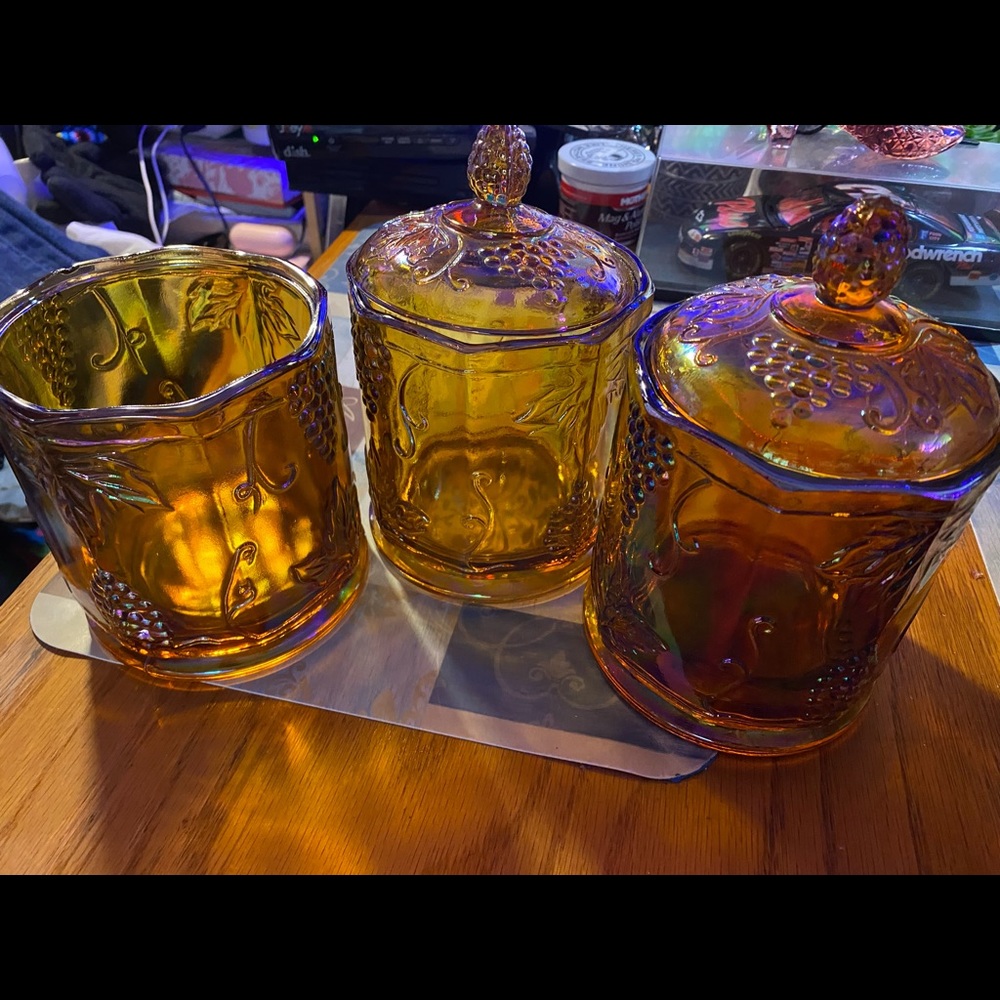 3 canisters in amber
